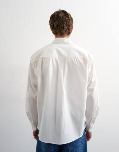 Model wearing Relaxed fit poplin shirt in white