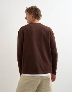 Model wearing Relaxed fit rib henley in brown
