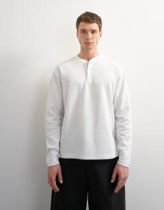 Model wearing Relaxed fit rib henley in ecru