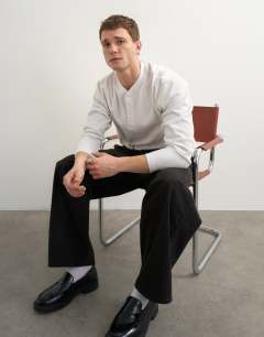 Model wearing Relaxed fit rib henley in ecru