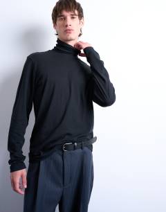 Model wearing Relaxed fit roll neck long sleeve t-shirt in black 