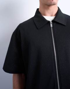 Model wearing Relaxed fit seersucker zip through shirt in black