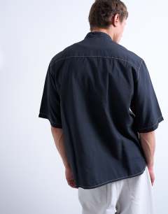 Model wearing Relaxed fit shirt with contrast stitch detail in black
