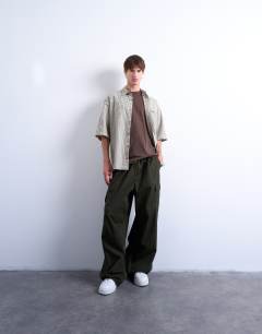 Model wearing Relaxed fit short sleeve textured check shirt in stone