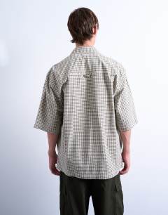 Model wearing Relaxed fit short sleeve textured check shirt in stone
