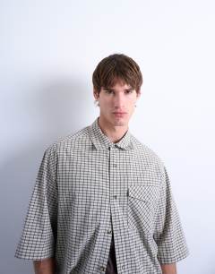 Model wearing Relaxed fit short sleeve textured check shirt in stone