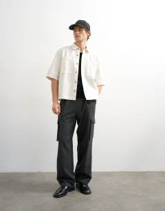 Model wearing Relaxed fit short sleeve twill crop overshirt in contrast ecru