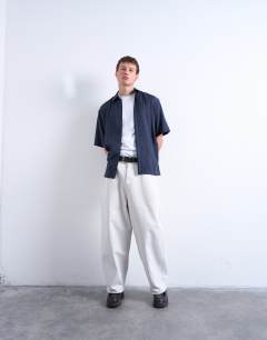 Model wearing Relaxed fit short sleeve twill shirt in navy