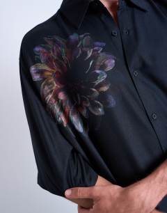 Model wearing Relaxed fit short sleeve twill shirt with placement floral print in black