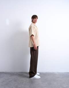 Model wearing Relaxed fit short sleeve two tone textured shirt in stone