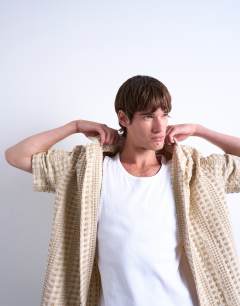 Model wearing Relaxed fit short sleeve two tone textured shirt in stone