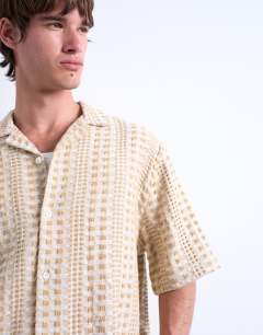 Model wearing Relaxed fit short sleeve two tone textured shirt in stone