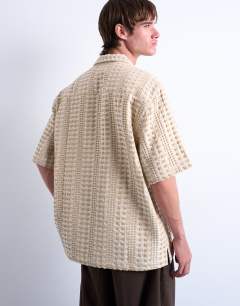 Model wearing Relaxed fit short sleeve two tone textured shirt in stone