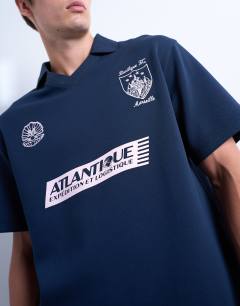 Model wearing Relaxed fit sports polo shirt with Marseille back embroidery in navy