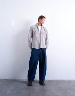 Model wearing Relaxed fit stripe shirt in brown