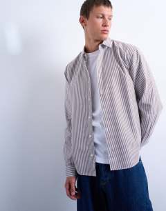 Model wearing Relaxed fit stripe shirt in brown