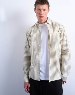 Model wearing Relaxed fit stripe shirt in dusty green