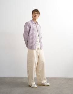 Model wearing Relaxed fit stripe shirt in purple