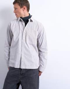 Model wearing Relaxed fit stripe shirt in tonal ecru & brown