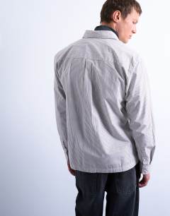 Model wearing Relaxed fit stripe shirt in tonal ecru & brown