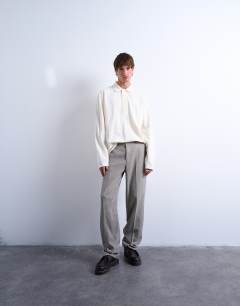 Model wearing Relaxed fit structured stitch long sleeve polo in ecru 