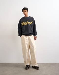 Model wearing Relaxed fit sweatshirt with chenille Pittsburgh in black