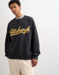 Model wearing Relaxed fit sweatshirt with chenille Pittsburgh in black