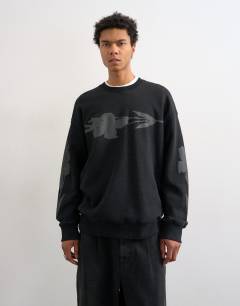 Model wearing Relaxed fit sweatshirt with digital floral front and back print in washed black