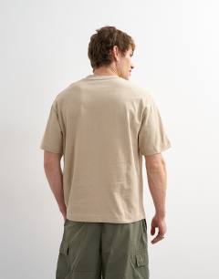 Model wearing Relaxed fit t-shirt in stone