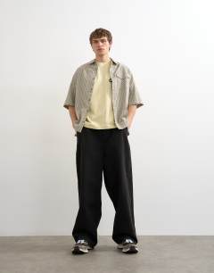 Model wearing Relaxed fit t-shirt with Amor embroidery in washed yellow