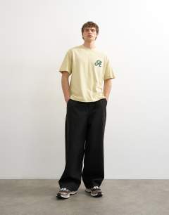 Model wearing Relaxed fit t-shirt with Amor embroidery in washed yellow