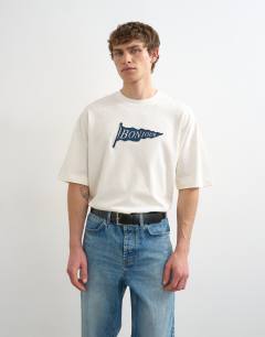 Model wearing Relaxed fit t-shirt with Bonjour Flag patch in ecru