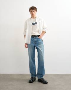 Model wearing Relaxed fit t-shirt with Bonjour Flag patch in ecru