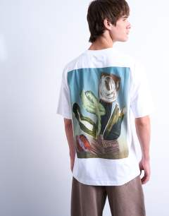 Model wearing Relaxed fit t-shirt with front and back collage floral print in white