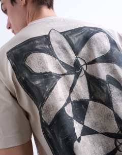 Model wearing Relaxed fit t-shirt with front and back floral print in stone 