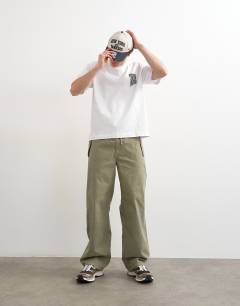 Model wearing Relaxed fit t-shirt with front and back forgiveness print in black