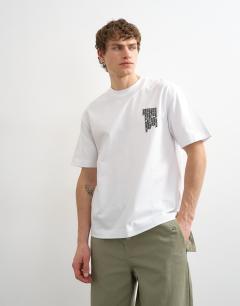 Model wearing Relaxed fit t-shirt with front and back forgiveness print in black