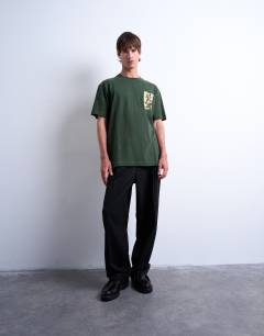 Model wearing Relaxed fit t-shirt with front and back watercolour shapes print in dark green