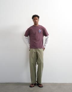 Model wearing Relaxed fit t-shirt with front and black floral embroidery in purple