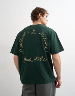 Model wearing Relaxed fit t-shirt with monsieur front and back embroidery in dark green
