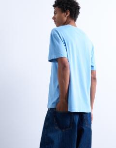 Model wearing Relaxed fit t-shirt with Vermont Phys Ed embroidery in washed blue
