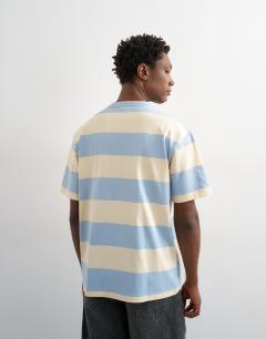 Model wearing Relaxed fit t-shirt with wide stripe in blue and cream 