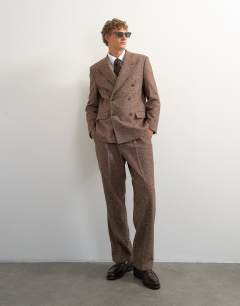 Model wearing Relaxed fit textured double breasted blazer in brown