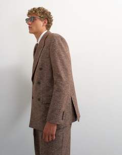Model wearing Relaxed fit textured double breasted blazer in brown