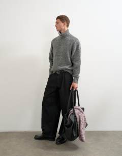 Model wearing Relaxed fit textured roll neck knitted jumper in charcoal