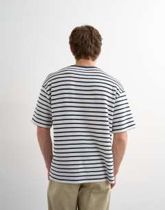 Model wearing Relaxed fit textured t-shirt with breton stripe in navy