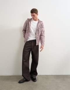Model wearing Relaxed fit textured zip through knitted hoodie in pink