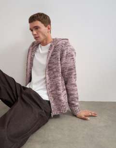 Model wearing Relaxed fit textured zip through knitted hoodie in pink
