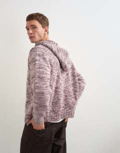 Model wearing Relaxed fit textured zip through knitted hoodie in pink