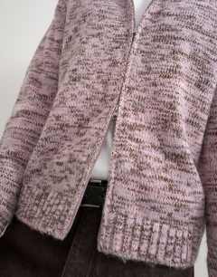 Model wearing Relaxed fit textured zip through knitted hoodie in pink